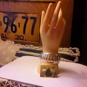 Sterling cuff bracelet and earrings.